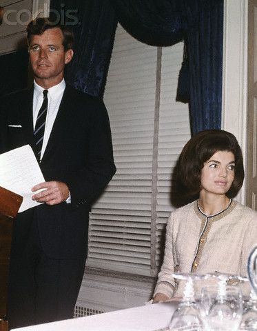 Jacqueline and Robert Kennedy at Conference Original caption:New York: Senator elect Robert F. Kennedy and Mrs. Jacqueline Kennedy are shown at a news conference the Senator-elect called, Dec. 13th to announce that public contributions to the john F. Kennedy Memorial Library Fund have exceeded $10 million. He declared, "We are all pleased by the fact that this project can now take concrete form." Date Photographed:13 December 1964 John Junior, Jackie Onassis, John Fitzgerald, Jackie O, 10 Million, Southampton, First Lady, Kirby, Style Icon