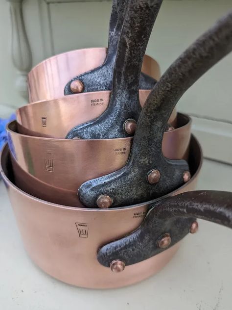 Discover the exceptional with a set of 4 vintage French copper pots, each proudly marked "Made in France" with the iconic Mafter logo. What sets these apart is their substantial weight and impressive thickness, measuring around 1.8 to 2 mm. These copper pots and pans are not just cookware; they are exquisite decor accents that seamlessly enhance your French country kitchen decorating, adding both functionality and timeless allure to your culinary space. Copper Pots And Pans, Vintage Copper Pots, Copper Cookware, Copper Pots, French Antique, Vintage Copper, Pots And Pans, Antique Copper, Vintage French