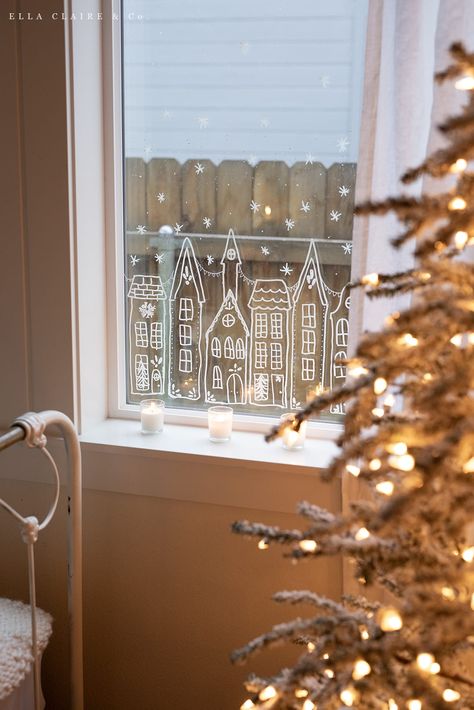 Create a beautiful European Christmas village in your window with this free printable stencil. Simply print and trace houses in your window for a charming holiday decoration that will last all winter long. Stencil Windows Ideas, Window Decoration For Christmas, Christmas Tree By Window, Christmas House Window Display, Christmas Window Decorating Ideas, Christmas Chalk Marker Window, Christmas Window Sill Decor, Window Design Christmas, Painted Holiday Windows