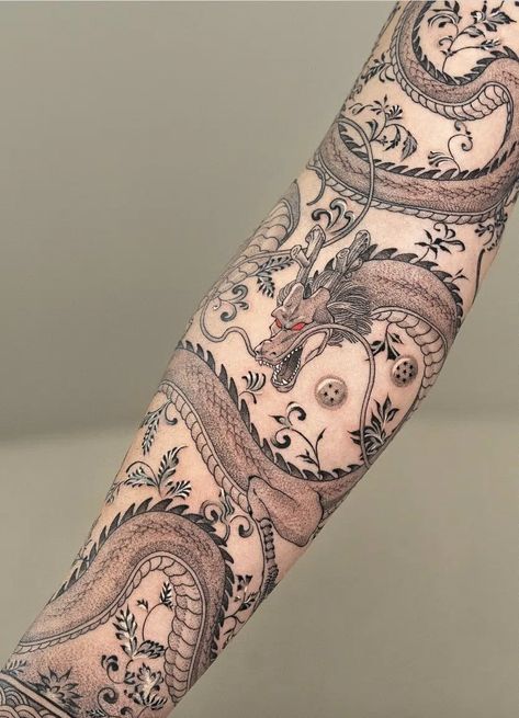 37+ Dragon Tattoo Ideas to Ignite Your Inspiration Today! (With Pictures) Wrapping Tattoo Ideas, Mens Dragon Sleeve Tattoo, Modern Dragon Tattoo, Dragon Tattoo Sleeve For Men, Dragon Wrap Tattoo, Dragon Band Tattoo, Dragon Sleeve Tattoo Women, Delicate Dragon Tattoo, Dragon Wrapped Around Leg Tattoo