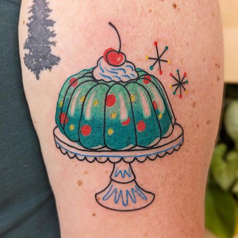 You remember the jello salad your grandma used to make? What the heck is actually in it? Does anybody eat that? Laura does! And she got a tattoo to commemorate that jello baby! #jello #jellomold #jellotattoo #midcenturymodern #midcenturymoderntattoo #mcm #mcmtattoo #tattoo #tattoos #tattooed #girlswithtattoos #tattooedgirls #stltattoo #stltatooartist #pastydevil #pasteldevilstudio #colortattoo #popculture #popculturetattoo #ladytattooers #tattoosnob #ladiestattooingworldwide #femaletattooar... Jello Tattoos, Pickle Tattoo, M Tattoos, Christmas Tattoo, Jello Salad, Female Tattoo Artists, Jello Molds, Jelly Mould, Female Tattoo