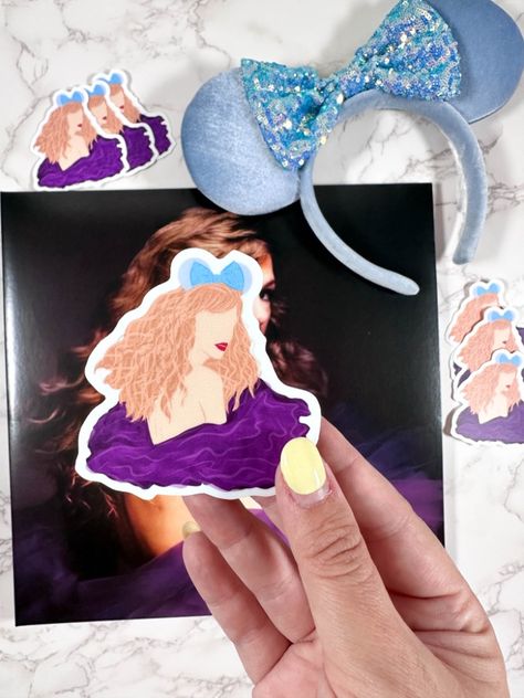 A Taylor Swift sticker in her Speak Now Taylor's Version era wearing disney ears. Taylor Swift Mickey Ears, Speak Now Taylors Version Vinyl, Speak Now Taylor Swift Vinyl, Speak Now Sticker Taylor Swift, Taylor Swift Guitar Sticker, Taylor Swift Signed Vinyl, Disney Sticker, Disney Ears, Mickey Ears