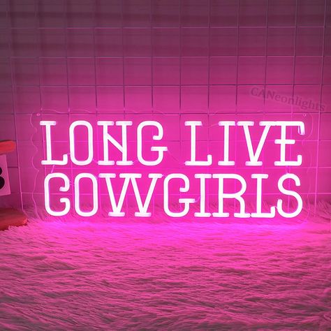 Saddle up and celebrate the spirit of the wild west with our "Long Live Cowgirls" Neon Sign! This custom LED light is the perfect gift for cowgirl lovers and adds a touch of western charm to any space. Whether you're hosting a cowboy party or simply want to adorn your ranch walls with stylish decor, this cowgirl-inspired neon sign is sure to make a statement. Let the frontier spirit shine bright with this unique piece of cowgirl wall art that pays homage to the fearless women of the west! What i Long Live Cowgirls Neon Sign, Cowgirl Signs, Cowgirl Theme Room, Pink Cowgirl Home Decor, Room Ideas Western Aesthetic, Cowgirl Neon Sign, Neon Cowgirl Aesthetic, Pink Cowgirl Room, Cowgirl Decorations