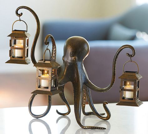 This whimsical eight armed octopus statue uses three of its arms to hold little tea light illuminated lanterns and the other five to keep itself balanced upright. Octopus Lantern, Octopus Decor, Steampunk Octopus, Deco Originale, Gothic Steampunk, Decor Guide, Kraken, Tealight Candle Holders, Nautical Decor