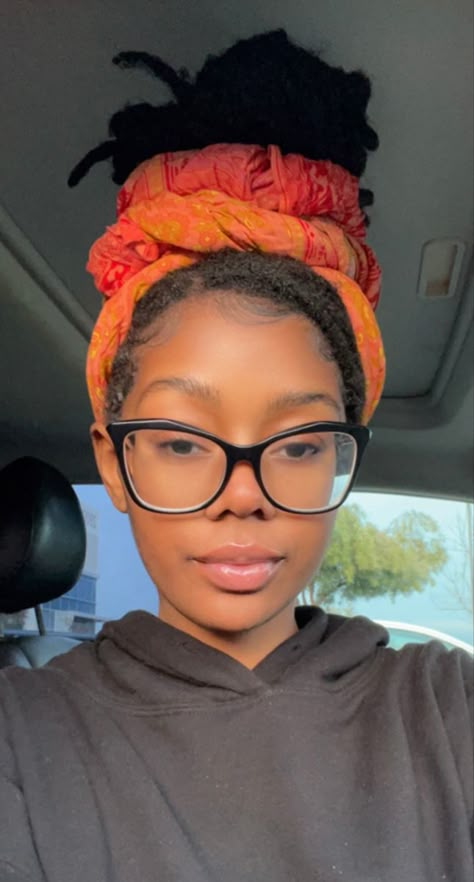 Black girl with locs in a bun in an orange head wrap. Hairstyles For Medium Locs Black Women, Locs Wrap Styles, Headband With Locs, Locs And Hats, Loc Wraps, Headwrap Hairstyles, Twist Cornrows, Medium Hair Braids, Brown Girls Makeup