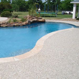 Different Types of Pool Decking | Custom Pool Decking Decks Around Pools, Swimming Pool Images, Deck Renovation, Pool Decking, Cheap Pool, Fiberglass Swimming Pools, Gravel Patio, Pool Renovation, Pool Colors