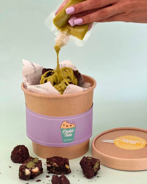 Chunky Choc Pistachio Cookie Tub Is NOW LIVE 💚 Indulge in our gourmet Chocolate Pistachio Chunky Cookies, baked with rich Belgian chocolate and real pistachios 🤩 Enjoy a delicious flavor explosion with every bite! Order your tub for delivery in 🇦🇪 #ShopNow : https://sugaholic.com/desserts/Chunky-Cookies/pistachiocookietub #Sugaholic #cookiesindubai #cookietubs #chunkycookies Cookies Bites, Chocolate Business, Brownies Cookies Packaging, Jumbo Cookie Packaging, Cookies Business Ideas, Thick Chunky Cookies, Chunky Cookies Chocolate Chips, Pistachio Chocolate Chunk Cookies, Bakery Packaging Design