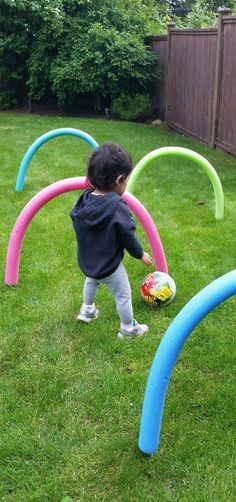 Have some fun outdoors this summer by making this super easy and cheap obstacle course using pool noodles from the dollar store and bbq skewers. Great for children who are learning to crawl or for older kids to practice ball skills. Outdoor Kids Play Area, Bbq Skewers, Kids Outdoor Play, Outdoor Games For Kids, Pool Noodles, Backyard Games, Games For Toddlers, Kids Play Area, Obstacle Course