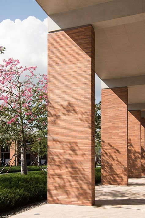 Credit: Nigel Young / Foster + Partners Chinese University, Building Columns, Mountain Architecture, Brick Columns, Architectural Columns, Brick Interior, Mixed Use Development, Foster Partners, School Interior