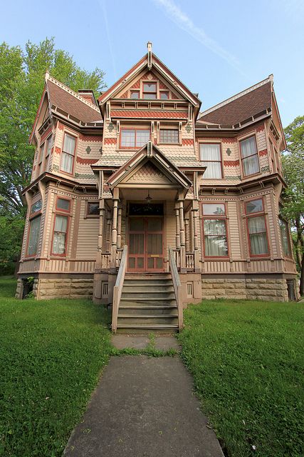 I really like this Stick Style/Eastlake house in Pike County MO. It has an interesting "twist" on the ends, and the details are wonderful. I might balance the orange-y and brown palette with something else, but I do like the paint job. Old Victorian Homes, Pike County, Chicago Real Estate, Victorian Buildings, Old Mansions, Unusual Homes, Buy A Home, Victorian Architecture, Making Life Easier