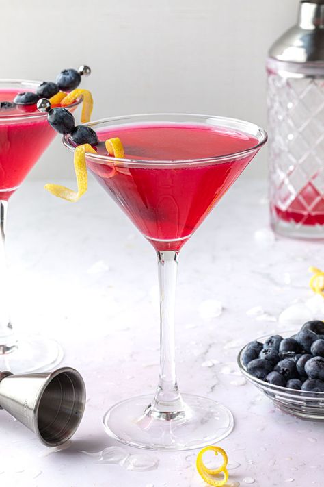 This blueberry lemon drop martini is made with fresh vodka, lemon juice, and blueberry simple syrup – with a little bit of limoncello to enhance the lemon flavor – to create a tart and sweet cocktail that’s super refreshing. Blueberry Lemondrop Recipe, Blueberry Lemondrop Martini, Blueberry Lemon Drop Martini, Lemondrop Martini, Blueberry Lemon Drop, Cotton Candy Martini, Martini Recipes Easy, Blueberry Martini, Blueberry Simple Syrup