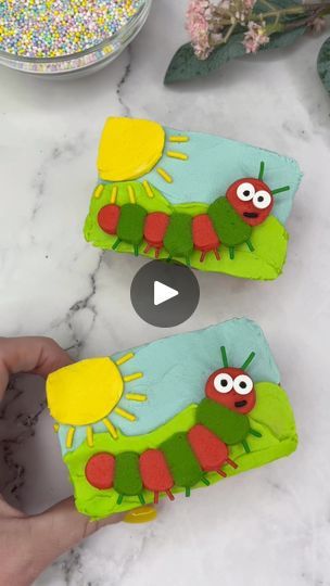 309K views · 6K reactions | Using a mini cake as a blank canvas 🎨☀️How adorable are these mini cakes that I made for Wilton Cake Decorating 🐛💚☀️How to 💁🏼‍♀️🐛☀️🐛Bake your cake batter in the mini loaf pans.🐛Use an offset spatula to add blue to the top half and green to the bottom half.🐛Add yellow to the top left corner for a sunshine.🐛Add long yellow sprinkles for the sun rays.🐛Use the red and green buttercream and piping tip 10 to add buttercream dots along the centre of the cakes.🐛Press the cake down onto parchment paper.🐛Freeze for 20 minutes.🐛Remove from the paper.🐛Add two small candy eyes and half a long black sprinkle for the Use green and red long sprinkles for the antenna and the legs. #cakedecorating #cupcake #cakedbyrach #cakeart #wiltoncakes #cutefood | Caked By Rac Green Buttercream, Hobbit Food, Mini Loaf Cakes, Offset Spatula, Candy Eyes, Piping Tip, Mini Loaf Pan, Wilton Cake Decorating, 1st Birthday Cakes