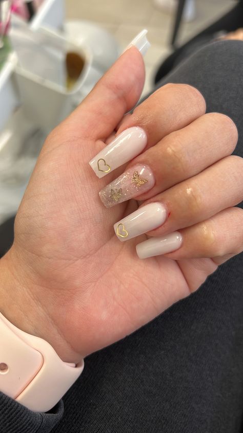 Acrylic Nail Gold Designs, White And Gold Heart Nails, Nude Nails With Butterflies, Nails With Gold Butterflies, Nails With Encapsulated Flowers, Encapsulated Heart Nails, Nails With Gold Heart, Gold Heart Nails, Gold Butterfly Nails