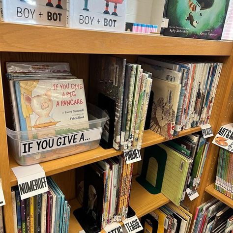 The Book Wrangler on Instagram: "Trying to encourage more browsing with bins placed on the shelves to break up the monotony of spines. I think we all agree the more front facing books we can showcase, the more likely they are to go into circulation. These bins can be flipped through and even taken off the shelf to get a better look. I use them in picture books, chapter book fiction and nonfiction. You can also change them out by replacing the label and shifting them on the shelf to spotlight ano Front Facing Book Display, Book Wrangler, Displaying Books, Book Bins, Fiction And Nonfiction, Chapter Books, Picture Books, On The Shelf, Librarian