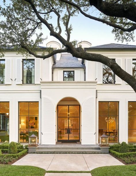 Check out the full home tour on our blog now! This exterior is everything! The overarching trees + white exterior + white shutter + black steel and glass doors + arched entryway + large scale lanterns | Collins Interiors Exterior Front Entrance Ideas, Front Entrance Ideas, Exterior Door Styles, White Exterior Houses, Steel Doors And Windows, Entrance Ideas, House Outside Design, Front Entrance, Windows Exterior