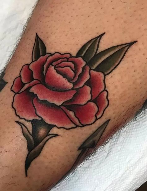 The Meanings Of Carnation Tattoos (Explained In Detail) Old School Tattoo Rose, Istanbul Tattoo, Carnation Tattoo, Inner Arm Tattoos, Traditional Tattoo Flowers, Rose Tattoos For Men, Traditional Style Tattoo, Inner Arm Tattoo, Red Rose Tattoo