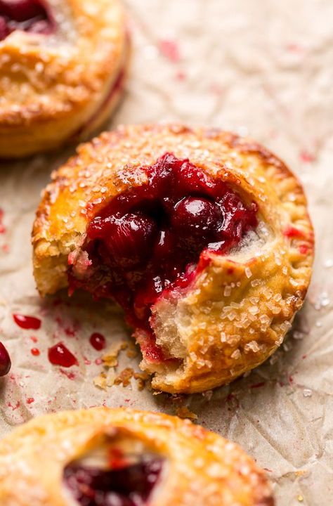 Rustic Cranberry Hand Pies feature a flaky crust and a delicious orange cranberry filling! And their petite handheld size makes them perfect for sharing this holiday season! It's just not Christmas in our house without these on the table! Meringue Photography, Personal Pies, Cherry Hand Pies Recipes, Cranberry Desserts, Pie Board, Delicious Food Ideas, Cranberry Filling, 2024 Holidays, Hand Pies Savory