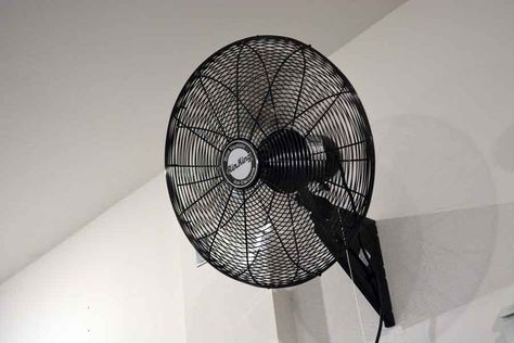 A garage fan is one of the best ways to cool down your garage. Find out how to set up your fan whether you have windows in your garage or not. Ceiling Fan In Garage, Garage Fans Ceiling, Cool Garage Lighting, How To Keep A Garage Cool In The Summer, Wall Fans Ideas, Garage Fan Ideas, Garage Ventilation Ideas, Garage Cooling Ideas, Garage Ceiling Fan