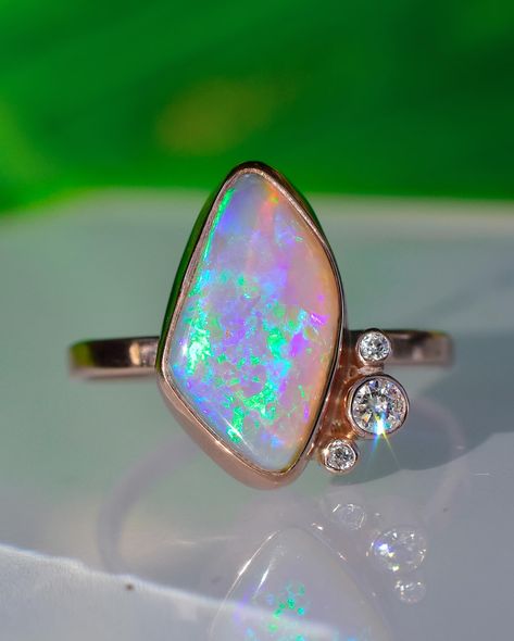 I just finished this gorgeous Opal Statement Ring made with the dreamy stone. I cut the other day in a live! I love how she came out with the stone shape and layout, adorn with sparkling diamonds, and 14 karat rose gold! Luxury Opal Ring With Rose Cut Diamonds As Gift, Luxury Polished Opal Ring With Oval Cabochon, Luxury One-of-a-kind Opal Jewelry, Opal Statement Ring, Luxury Elegant Opal Gemstones, Luxury Polished Opal Ring, Oval Cabochon, Split Shank Ring, Heirlooms Jewelry, Australian Opal