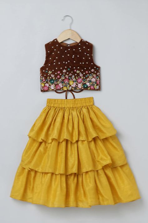 Shop for this happy collection of Yellow Velvet Embroidered Floral Top And Layered Skirt Set For Girls by Byb Premium online at Aza Fashions. Indian Dresses For Kids, Crop Tops For Kids, Cotton Frocks For Kids, Frocks For Kids, Kids Party Wear Dresses, Kids Dress Collection, New Saree Blouse Designs, Saree Jewellery