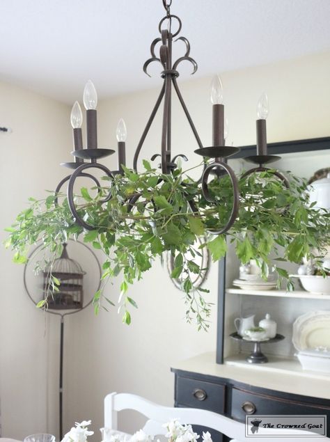 Adding Holiday Greenery to Simple Chandeliers - The Crowned Goat Chandelier With Greenery, How To Decorate A Chandelier, Chandelier Greenery, Decorating Chandeliers, Boho Garden Party, Simple Chandelier, Vintage Wedding Table, Dining Chandelier, Outdoor Chandelier