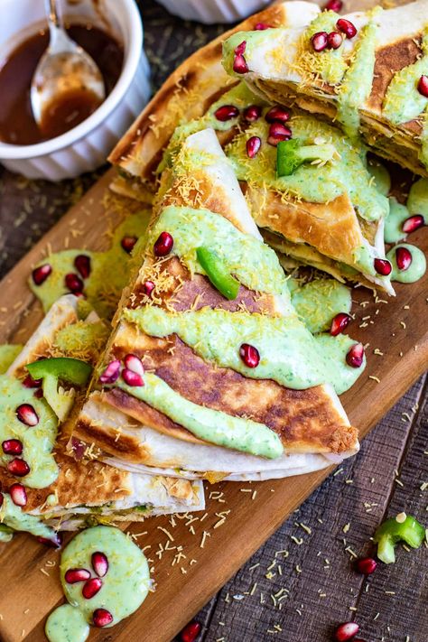 This Samosa Chaat Crunch Wrap recipe is my fun spin on the very popular Indian samosa. All the flavors of a samosa tucked in a wrap, but healthy. It is a delightful Indian Mexican fusion recipe for your next meal or a party. #fusionrecipe #samosa #chaat Masala Corn, Mango Panna Cotta, Samosa Chaat, Crunch Wrap, Samosa Recipe, Indian Appetizers, Fusion Dishes, Corn Dip, Chaat Recipe