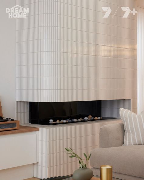 Hannah & Johnny created this beautiful feature fireplace for the lucky homeowners, Brad & Mel. Hannah & Johnny chose our Ignite White Gloss Mosaic around this curved feature wall to draw the eye up and highlight the extravagant new ceiling height ✨ We loved watching the first half of the Victorian house reveals and can't wait to see these homes all finished! 📺 Watch Dream Home on Channel 7 and 7plus. #DreamHomeAU Curved Feature Wall, Modern Fireplace Tiles, Tiled Fireplace Wall, Curved Fireplace, Feature Fireplace, Kitchen Hood Design, Balcony Tiles, Scandinavian Tile, Eclectic Tile