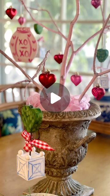 marcie millholland on Instagram: "A little love-themed seasonal decor never hurt anybody! There’s still time to add some ❤️ to your decor. I made the heart topiary ornaments and XO ginger jars but even paper hearts would be sweet! The urn was thrifted, I spray painted sticks from the yard (btw sticks may appear smaller outside than they do IN your home!) and added little heart ornaments I found for less than $2 pkg! It doesn’t have to be pricey or fancy - just done with love! #valentinesdecorations #diy #topiaryornaments #chinoiseriechicstyle #adwellingtoremember #bhgholiday #graciouslivingstyle #goodwillfinds #blueandwhitestyle #bhgstyle #southernliving #southernstyle" Rose Topiary Diy, Heart Topiary Diy, Heart Topiary, Valentine Topiary, Topiary With Bow, Wicker Hearts Decoration, Topiary Diy, Blue And White Style, Painted Sticks