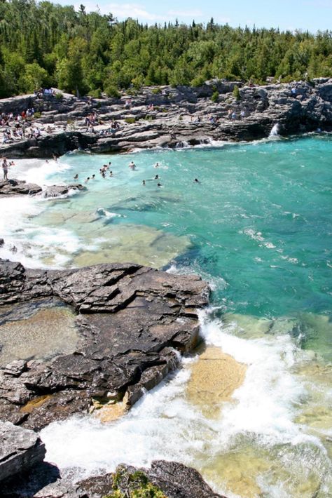 GEORGIAN BAY, TUCKED into Ontario's Lake Huron, is a bit of a misnomer. At 5,792 square miles it's not that much smaller than Lake Ontario (7,320 square miles), earning it the nickname "the sixth Great Lake." With more than 1,240 miles of grayish-pink granite shoreline, it is part of a UNESCO biosphere reserve and a summer freshwater playground for boaters, anglers, and kayakers. Georgian Bay Ontario, Ontario Landscape, Lake Huron Ontario, Grayish Pink, Tobermory Ontario, Ontario Road Trip, Pink Granite, Ontario Travel, Michigan Vacations