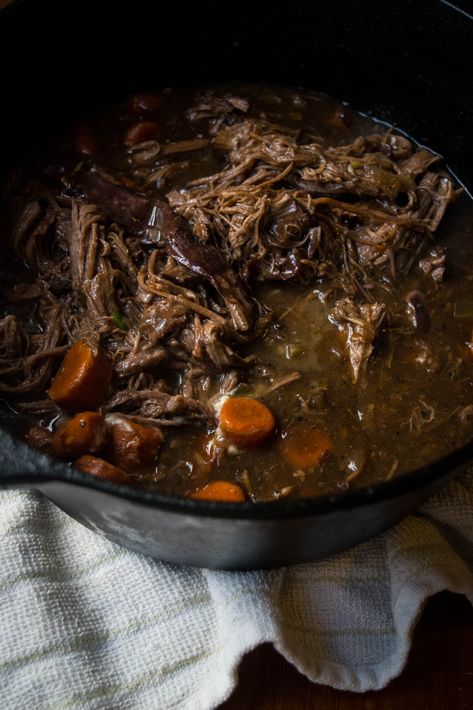 This easy and delicious one-pot Dutch Oven Pot Roast is slow cooked in a cast iron Dutch oven with carrots, celery, herbs, wine and garlic. The tender beef and veggies melt in your mouth and go great over a pile of creamy mashed potatoes! Roast Beef Manhattan Recipe, Irish Pot Roast, Boneless Chuck Roast Recipes, Cast Iron Roast, Grinder Sandwiches, Roast In Dutch Oven, Cast Iron Skillet Steak, Cast Iron Dutch Oven Cooking, Homestyle Recipes