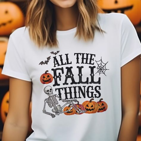 🎃🍂 Calling all fall lovers! 'All The Fall Things' 👻💀 This cute and funny Halloween shirt is perfect for cozying up with your favorite pumpkin spice latte and embracing the spooky season in style! 🧡👻 Get yours now and rock all the fall vibes! Link In bio! . . . #zazzlemade, #allthefallthings, #halloweenshirt, #fallfashion, #fallstyle, #spookyseason, #cutefalloutfits, #funnyhalloweentees, #pumpkinvibes, #fallthings, #skeletonshirt, #pumpkinpatchvibes, #fallclothes, #halloweenoutfit, #fallappa... Pumpkin Shirt Ideas, Fall Lovers, Fall Things, Skeleton Shirt, Pumpkin Shirt, Cute Fall Outfits, Pumpkin Spice Latte, Funny Halloween, Shirt Ideas