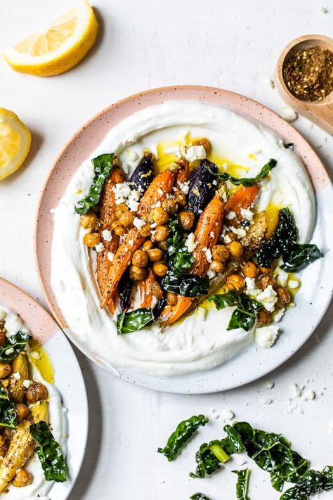 Roasted Carrots and Chickpeas seasoned with za’atar and served over Greek yogurt with lemony kale makes a wonderful side dish or meatless main! #plantbased #yogurtbowls #vegetarian #carrots #chickpeas Roasted Carrots And Chickpeas, Carrots And Chickpeas, Roasted Rainbow Carrots, Yogurt Bowls, Roasted Carrot, Rainbow Carrots, Za Atar, Yogurt Bowl, Carrot Recipes