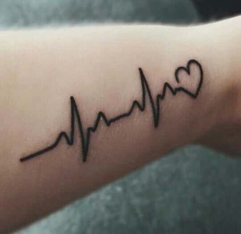 Popularly known as the EKG line tattoo, the pulse symbol is similar to a little monitor with an irregular line that bounces up and down just like when a patient is hooked to a heart… Tatuaje Ekg, Ecg Tattoo, Partner Tattoo, Pulse Tattoo, Ekg Tattoo, Heartbeat Tattoo Design, Name Tattoos On Wrist, P Tattoo, Nurse Tattoo