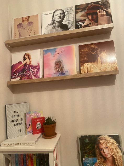 Taylor swift 
Taylor swift poster 
Taylor swift vinyl 
Taylor swift room decor 
Swiftie core 
Swiftie aesthetic Taylor Swift Vinyl Shelf, Preppy Taylor Swift Room, Music Lover Room Ideas, Room Decor Vinyl Records, Taylor Swift Collection Shelf, Taylor Room Aesthetic, Taylor Swift Themed Room Decor, Taylor Swift Vinyl Display, Taylor Swift Display