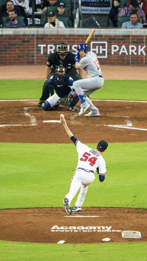 Max Fried releases the pitch in a game at Truist Park against the Chicago Cubs. Max Fried, Atlanta Braves Wallpaper, Mlb Baseball Players, Brave Wallpaper, Hot Baseball Players, Baseball Batter, Baseball Wallpaper, Baseball Photography, Baseball Fashion