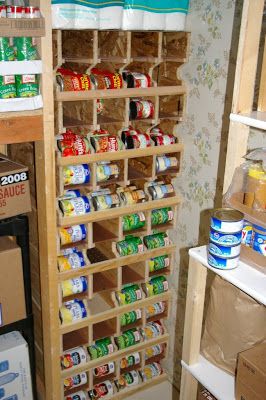 Here is a quick snap of some can rotation shelves that I put together a couple weeks back.  We have 7 shelves with 4 slots ea.  Each slot wi... Storage For Canned Goods Mason Jars, Can Rotation System Diy, Canned Good Storage, Diy Food Storage, Shelves Pantry, Corn Food, Food Rotation, Food Storage Rooms, Food Storage Shelves