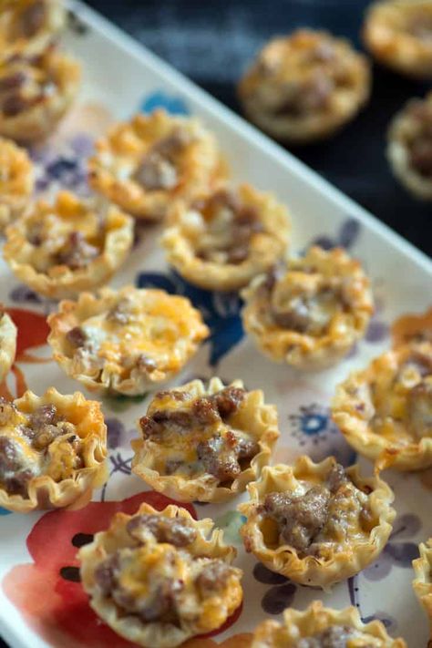 Sausage phyllo cups are a simple 4 ingredient appetizer that you can prepare in 10 minutes.  Simple doesn't mean they're not amazing. Great for game days or any occasion. #appetizer #phyllo #fingerfoods #butterandbaggage Wonton Cups Appetizers Sausage, Sausage Ranch Phyllo Cups, Philo Cup Recipes, Sausage Appetizers Finger Foods, Phillo Puff Pastry Cups, Philo Cups Appetizers Appetizer Recipes, Philo Cup Appetizers, Sausage Phyllo Cups, Sausage Phyllo