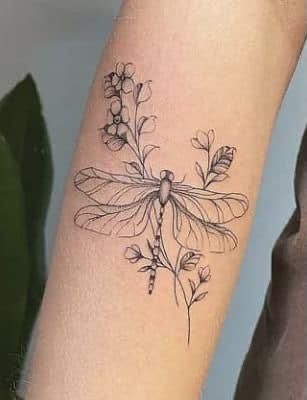 Floral Tattoo With Dragonfly, Arm Tattoos For Women Dragonfly, Dragonfly Wildflower Tattoo, Dragon Fly Tattoo Back Of Arm, Half Dragonfly Half Flower Tattoo, Dragon Fly Flower Tattoo, Dragonfly Dandelion Tattoo, Dragon Fly Tattoo With Flowers, Flowers And Dragonfly Tattoo