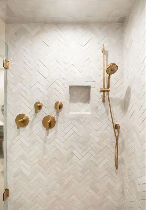 a neutral shower space completely clad with herringbone tiles, with a niche and some brass accents Beige Tile Shower Bathroom, Herringbone Vanity Backsplash, Neutral Shower Tile Ideas, Shower Ceiling Tile, Cloe Tile, Blue Herringbone Tile, Herringbone Tile Bathroom, Herringbone Shower, Attic Shower