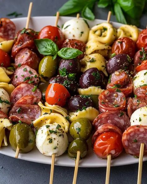 Italian Antipasto Skewers with Marinated Tortellini and Mozzarella Tortellini Skewers Italian Dressing, Meat Cheese Olive Skewer, Birthday Food Appetizers, Italian Restaurant Appetizers, Italian Kabobs Appetizer, Easy Italian Appetizers For A Crowd, Olive And Cheese Platter, Italian Theme Appetizers Dinner Parties, Italian Antipasto Skewers