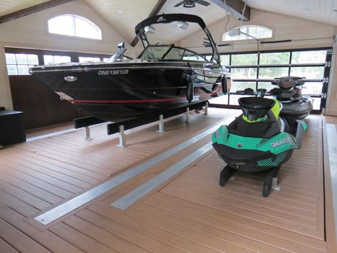 A unique wet slip boat lift design uses hydraulic power that is hidden under the decking to lift boats ranging in size from 4000 - 10,000 pounds. Boat House Ideas, Boat Lift Dock, Hangar Home, Wake Boat, Boathouse Design, Dock Ideas, Boat Garage, Lake Dock, Lakefront Living