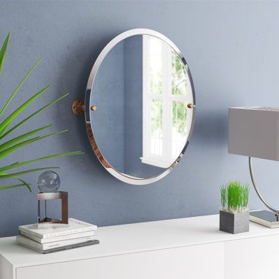 Clients will love this frameless mirror. Made from the actual pipe and featuring matching hardware that reflects the early 1900s industrial look, it's a great accessory look for any room where a mirror is needed. Mirror mounts easily and tilts to accommodate adjusting viewing angles for people of any height. This accessory is powder coated with lifetime materials to provide a decorative. The choice of superior materials makes this item free from corrosion and rust. Finish: Brushed Bronze | Willi Distressed Bathroom Vanity, Frameless Vanity Mirrors, Oil Rubbed Bronze Bathroom, Vanity Wall Mirror, Contemporary Wall Mirrors, Frameless Mirror, Oval Wall Mirror, Accent Doors, Round Wall Mirror