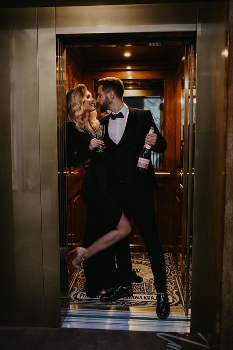 Couple Poses Elevator, Elegant Couple Poses Photo Ideas, Old Hollywood Glamour Couple Photoshoot, 007 Engagement Photos, Hotel Lobby Couple Photoshoot, Mafia Engagement Photos, Elevator Engagement Photoshoot, Elevator Couple Photos, Hotel Photoshoot Aesthetic