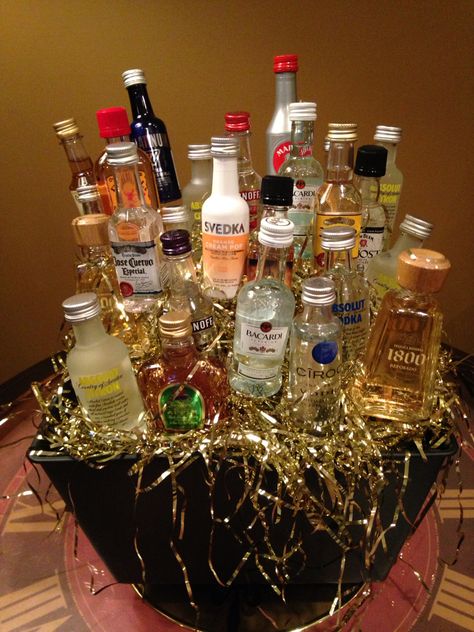 Homemade shooter bouquet: 25 variety of shooters, Tinsel, Plastic decorative box, Skewers, Hot glue, Under $50!! Shooters Gift Basket, Alcohol Shooter Gifts, Cute Liquor Gifts Mini Bottles, 21st Bday Shooters Gift, Booze Bouquet Mini Liquor Bottles, Booze Bouquet, Alcohol Bouquet, Alcohol Gift Baskets, Diy Liqour Bouqet