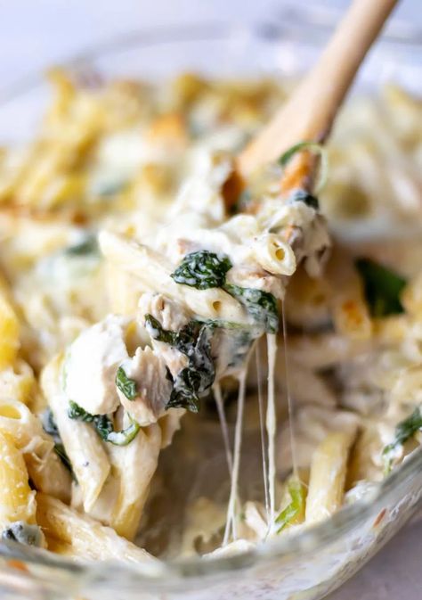 This Spinach Artichoke Chicken Alfredo Baked Ziti Recipe makes a wonderful dinner and is easier to make than you think! An easy homemade alfredo sauce tossed with chicken, spinach, artichokes and pasta then baked to perfection. #alfredosauce #chickenrecipes #casserolerecipes #bakedziti #dinnerrecipes Chicken Alfredo Baked Ziti, Alfredo Baked Ziti, Easy Homemade Alfredo, Chicken Artichoke Pasta, October Recipes, Spinach Alfredo, Chicken Alfredo Bake, Ziti Recipe, Spinach Artichoke Chicken