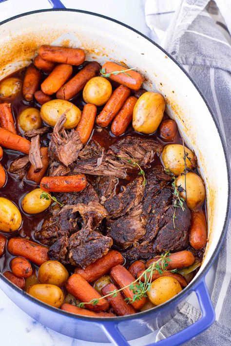 Dutch Oven Pot Roast! This delicious pot roast is made right in the Dutch oven. It's packed with a lot of flavor and cooked in the oven until tender and fall-apart. #cookingformysoul Braised Pot Roast Dutch Ovens, Pot Roast In The Oven Roasting Pan, Dutch Oven Recipes Easy, Delicious Pot Roast, Dutch Oven Pot Roast, Oven Pot Roast, Dutch Oven Recipes, Carrots And Potatoes, Beef Chuck