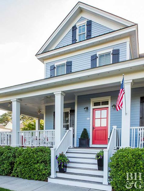 If it works with your home's color scheme, add an American flag. It's an affordable way to add a dash of color and a pop of patriotism. Mount the flag on a pillar or above your door. Blue Home Exterior, Siding Options, Home Exterior Makeover, Small Remodel, Exterior Makeover, Charming House, Exterior Remodel, Home Exterior, House Paint Exterior