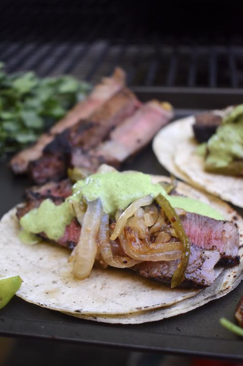 Grilled Ribeye Tacos with Spicy Cilantro Crema Carne Asada Tacos Recipe, Cilantro Crema, Skirt Steak Tacos, Flank Steak Tacos, Hand Held Food, Street Taco Recipe, Grilled Ribeye, Asada Tacos, Carne Asada Tacos