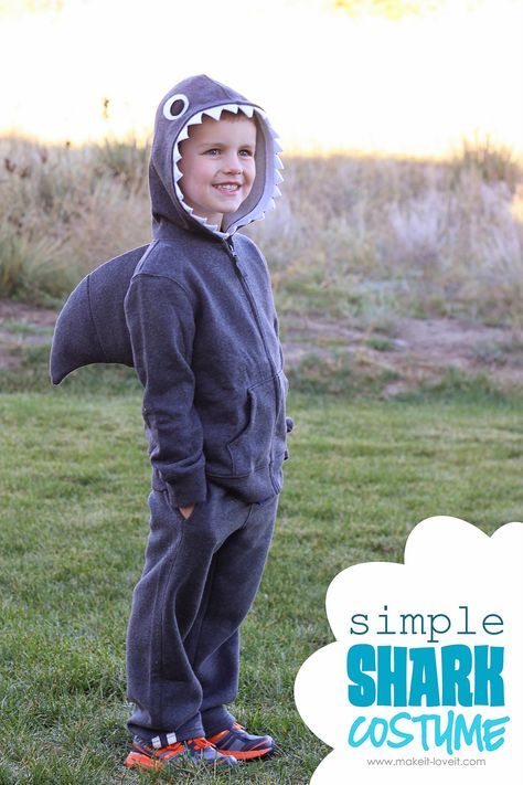 Okay, time for another costume idea.  Because, YES OH YES, there's still plenty of time to make a few costumes before Halloween!   When I asked for simple Halloween Costume ideas a couple weeks ago, several of you mentioned wanting to make a shark costume.   Okay.  Done.  Sounded fun to me!  And good news........it's pretty simple.  And is just a variation of something you may have already seen floating around the web.   HOWEVER.  This guy has an intimidating fin, to help him swim through dark o Diy Shark Costume, Under The Sea Costumes, Hoodie Halloween Costumes, Sea Costume, Handmade Halloween Costumes, Shark Costume, Shark Sweatshirt, Shark Costumes, Diy Halloween Costumes For Kids