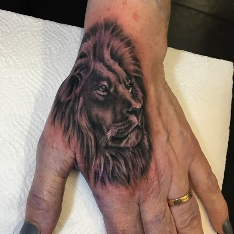 Lion On Hand Tattoo, Hand Lion Tattoos For Guys, Full Hand Lion Tattoo, Lion Head Hand Tattoo, King Lion Hand Tattoo Men, Cross Tattoo On Hand, Lion Hand Tattoo, Mens Lion Tattoo, Om Tattoo